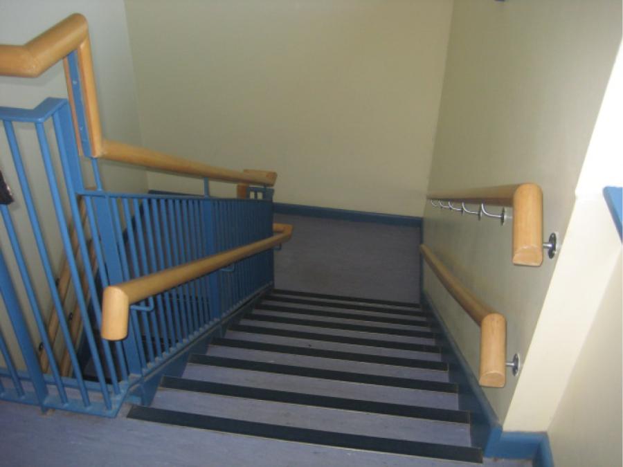 Stairs in ELC setting showing standard height and lower level handrails. Tigers Childcare, Balgriffin, Dublin