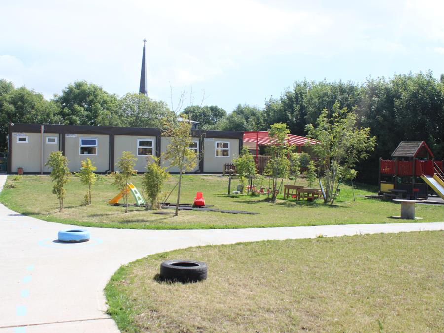 Combination of accessible path and grass play areas. Aghada, Community Playgroup, Aghada, County Cork