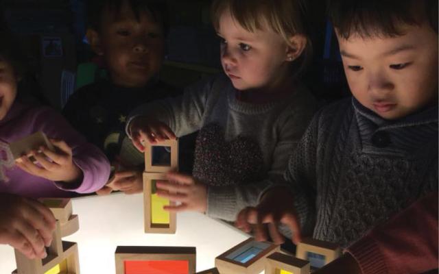 Children playing with block toys